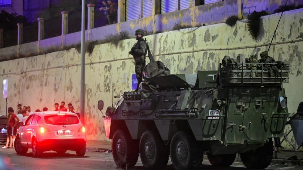 Spanish military stands guard at the border between the Spanish enclave of Ceuta and Morocco