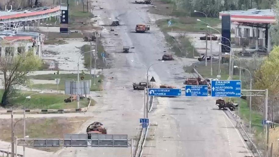 Damaged vehicles on a street in Oleshky