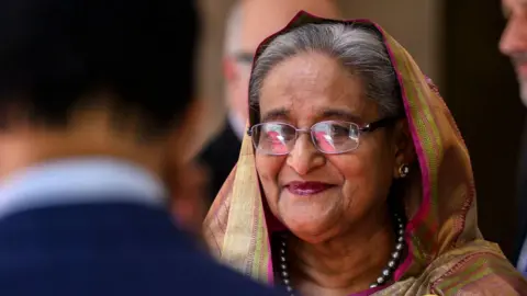 Sheikh Hasina Denies Crimes Against Humanity as Verdict Approaches