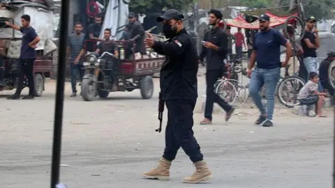 Escalating Violence in Gaza City: Clashes Between Hamas and Dughmush Family Result in 27 Deaths