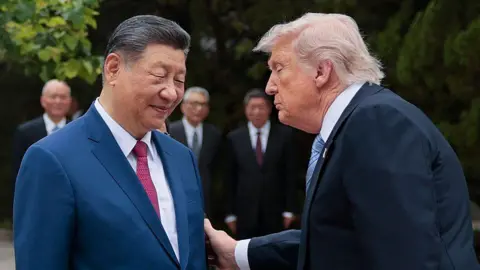 Trump's Beijing Visit: A Departure from Hawkish Rhetoric?
