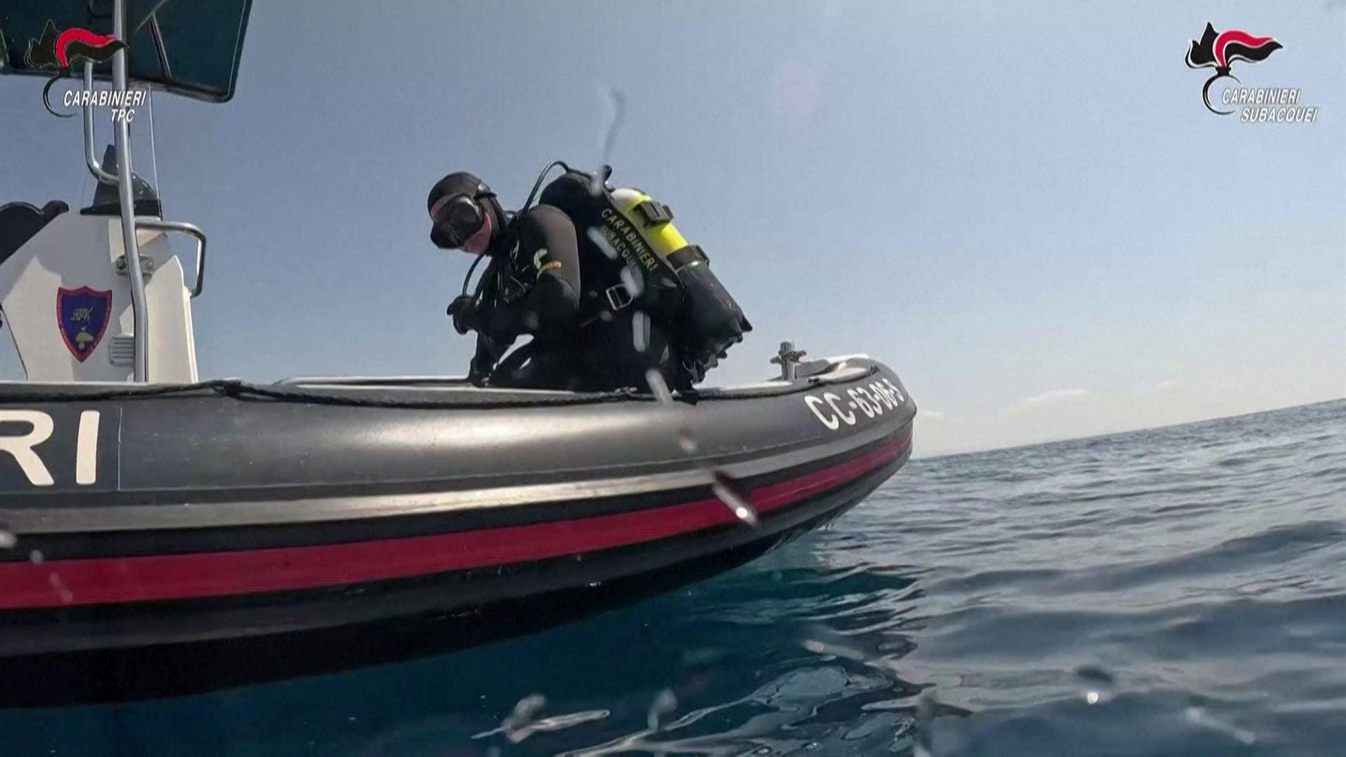 A diver explores the ancient Roman shipwreck off Sicily