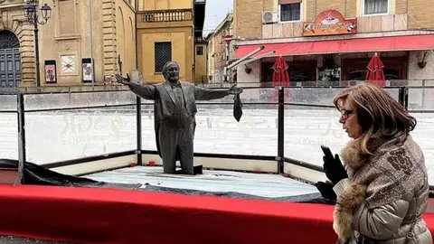 Pavarotti Statue Encased in Ice Rink Sparks Outrage in Italy