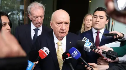 Sexual Abuse Charges Against Alan Jones Reduced Amid Legal Developments